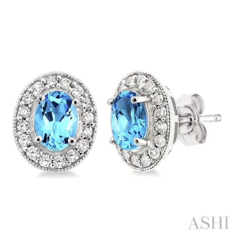 Funky Earrings for Casual Styles-7x5mm Oval Cut Blue Topaz and 3/8 Ctw Round Cut Diamond Earrings in 14K White Gold